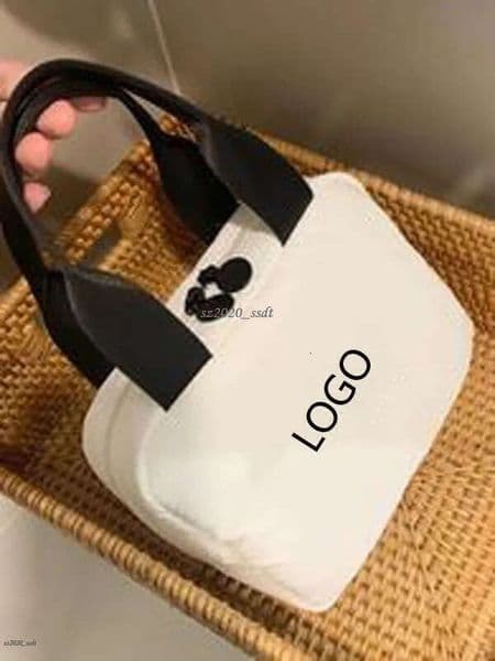 Designer's white handbag with embroidered letter logo, camellia, soft and oversized makeup toiletry bag