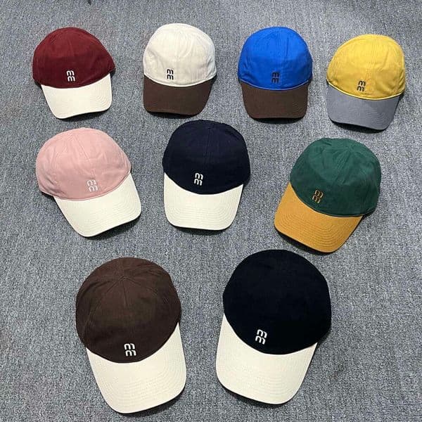 Designer style unisex baseball cap with embroidered lettering, drawstring, adjustable design, stylish patchwork design, black and brown Also suitable as a sun hat