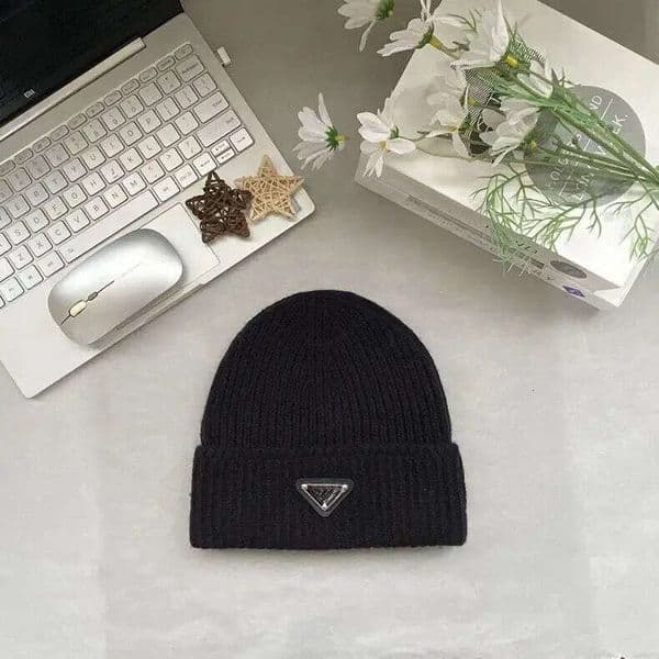 New versatile knitted triangle logo hat for both men and women, providing warmth. A knitted ear protector for couples, fashionable and thick woolen hat.