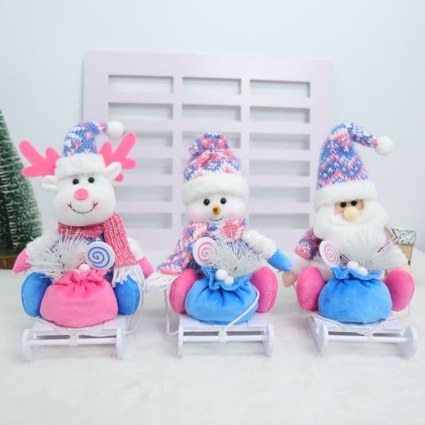Santa Claus, snowman, and reindeer plush ornaments with snowflake knit sweaters and tall hats, soft plush texture