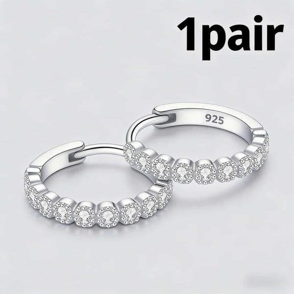 A single pair of elegant dainty silver stud earrings Versatile timeless fine jewelry for everyday luxury style Q260525