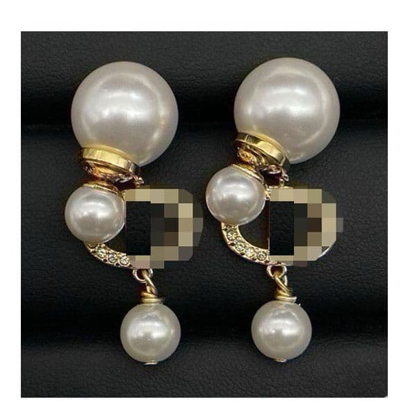 Designer earrings - vintage-style pearls of different sizes, colorful crystals, high-end and fashionable ear accessories, trendy and luxurious jewelry.