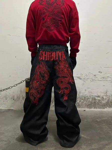 American retro embroidered pattern hip-hop jeans suitable for both men and women Y2K street cool floor length wide leg pants 260408