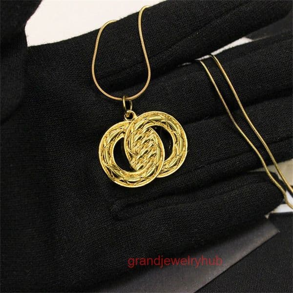 designer necklace cc jewelry Vintage Gold Necklace Womens Jewelry Featuring Intricately Designed Pendant Braided Motif Classic Timeless channels
