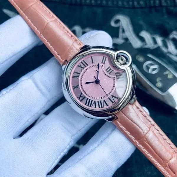 Ms. ZDR's elegant wristwatch, with pink leather strap, Roman numeral dial, automatic winding movement, sapphire glass cover, and fast delivery.