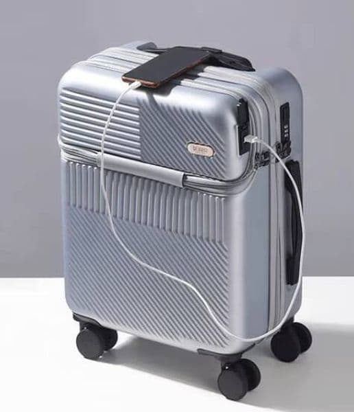 Luggage storage box ABS PC new design hard-sided suitcase with universal wheels, laptop compartment, USB port, and front zipper lock