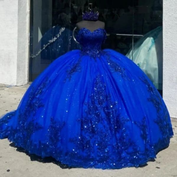 Quinceanera Birthday Gown: Luxurious Royal Blue Sleeveless Puffed Design Featuring Detailed Lace and Sparkling Beads