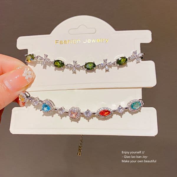 Silver-Tone Bracelet With Green Oval Gemstones & Crystal Floral Accents, Delicate Elegant Style, Ideal For Elevating Fresh Feminine Looks & Gifting
