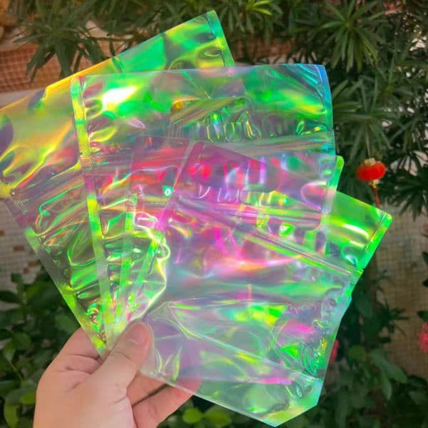 Unique 100Pcs Cute Laser Cookie Baking Biscuit Bread Plastic Zipper Handle Bags For Candy Snack Chocolate Stand up Packing Gift Bags