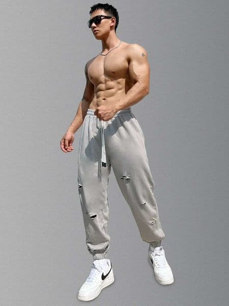 Mens streetwear casual trend cuffs pants jogging drag sports pants tearing Trouser gym fitness bottom mens clothingXJ250303