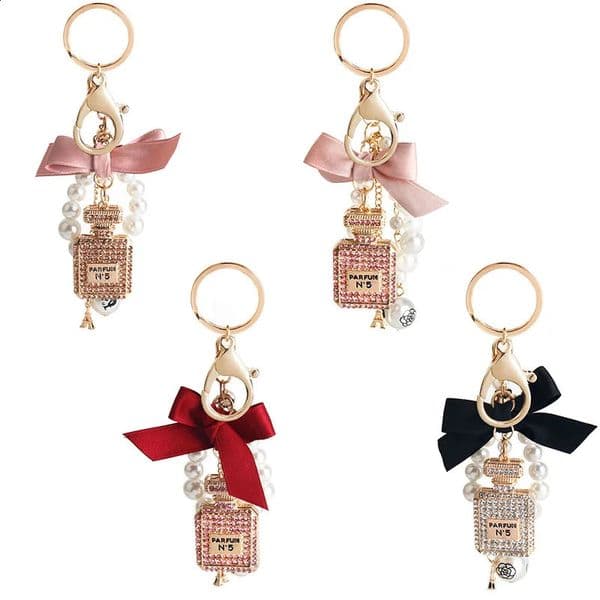 Perfume bottle bowknot alloy key chain pendant bag pearl pendant creative gift 250526