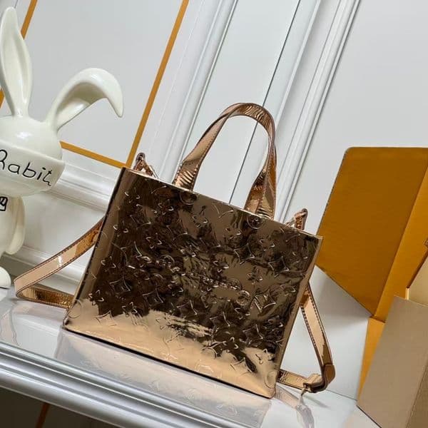The designer s new handbag features a glossy color changing design presenting a fashionable style and luxurious texture