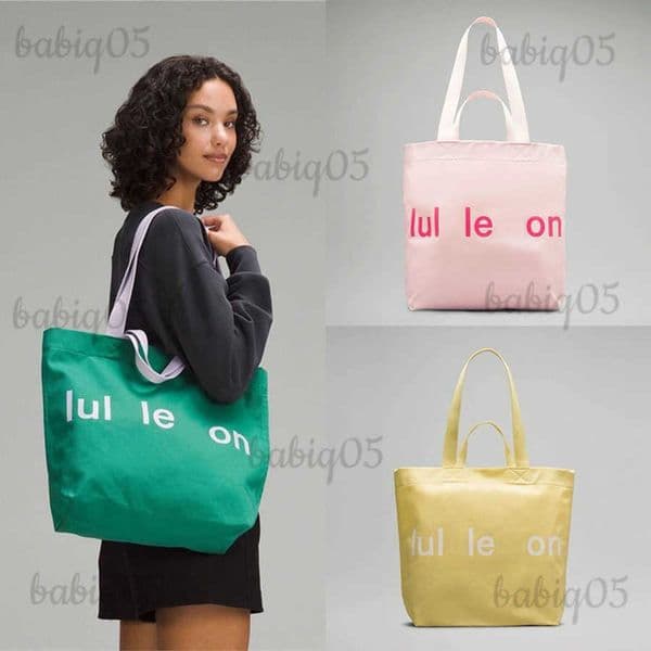 Designer bag ins fashion brand large capacity canvas male and female students fashion all-in-one leisure travel yoga bag fitness sports T250702