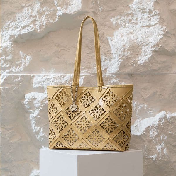 Luxury designer niche leather women spring and summer new niche cowhide large capacity portable hollow window grilles shoulder bag