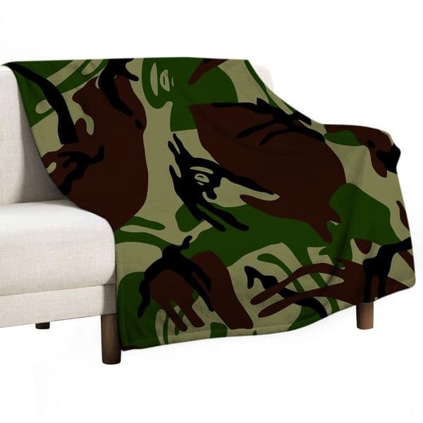 ddmythur Flannel blanket Anti-pilling flannel Air conditioning blanket couch with a green and brown camo blanket on top of it