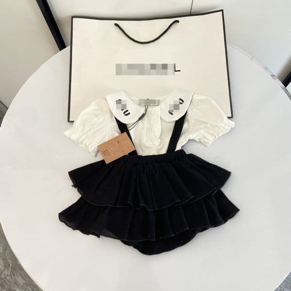 New hot selling designer clothes summer Korean style baby girl solid color large lapel shirt suspender bag butt pants skirt two-piece set