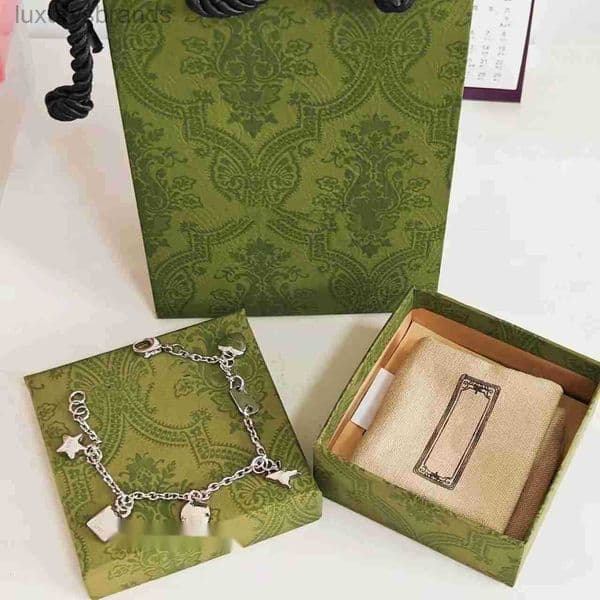 Versatile Star and Butterfly Pendant Charm Bracelet in Shiny Silver Finish