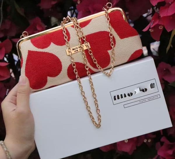 Clutch with snap closure, chain strap crossbody hand-held bag, hand-tightened switch makeup bag