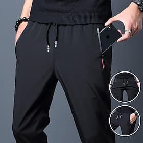Per uomo Pantaloni Pantaloni casual Pantaloni elasticizzati A cordoncino Vita elastica Tasca con cerniera Tinta unica Asciugatura rapida Giornaliero Abbigliame