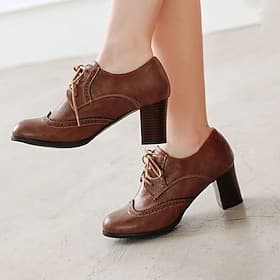vintage bruine oxford dameshakken - perfect voor kantoor- en formele evenementen, met brogue-details en comfortabele middenhak
