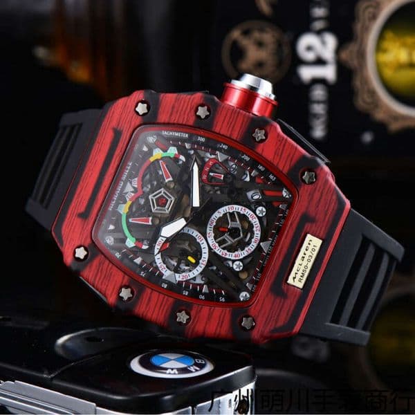 R M wrist watch R ichard Mi Brand R ichard M ille Watch McLaren limited edition featuring a black carbon fiber case orange accents dial designer multi functional timing