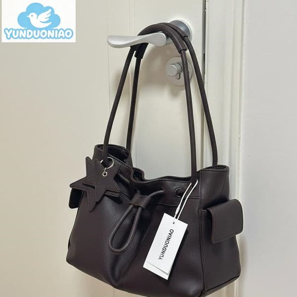 YUNDUONIAO new pattern soft leather drawstring bag, large capacity commuting handbag, casual cloud bag, women's hand-held shoulder bag