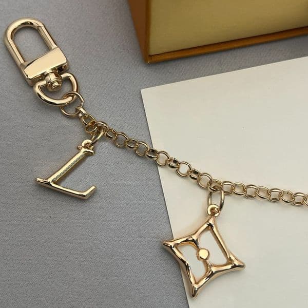 Gold Tone Multi Charm Bag Chain With Initial Pink Enamel Flower Mini Trunk Star Charms Stylish Daily Accessory Gift For Her