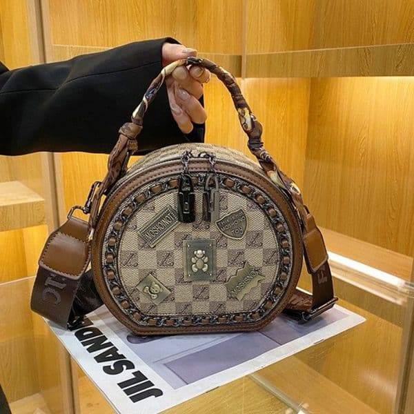 Designer bag High-end women's 2026 new model, popular versatile wide-strap shoulder crossbody bag, trendy personalized badge small round bag