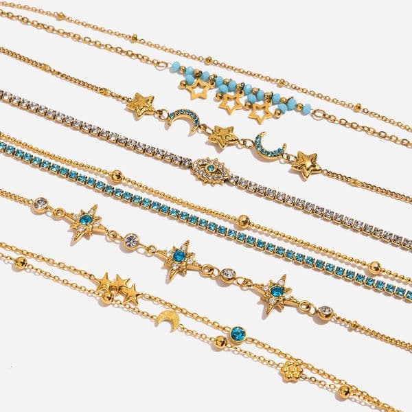 Elegant stylish resort-style 18K gold stainless steel bracelet with diamond-encrusted evil eye charm