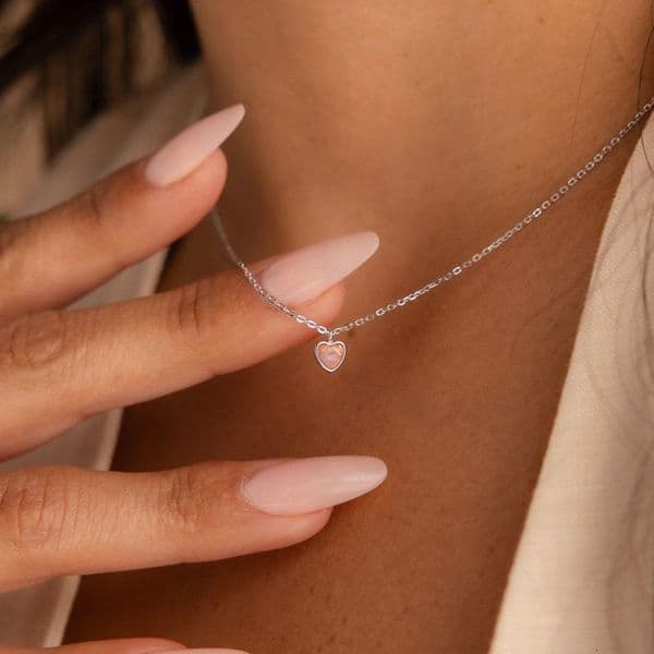 Pure silver necklace with an ins-style light luxury niche design, featuring a sweet pink opal heart pendant and cat's eye lock for summer