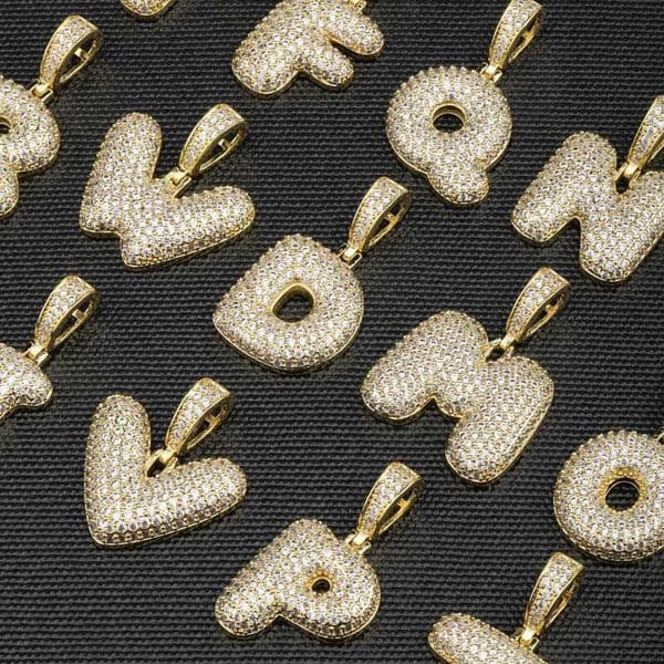 New European and American style diamond-set silver 26-letter pendant necklace with full diamonds and 18K letter beads. A unique hip-hop style accessory.