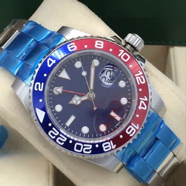 Classic men's automatic mechanical watch featuring a 40mm blue dial, a red-and-blue bezel, a stainless steel case, an automatic movement, and water resistance.