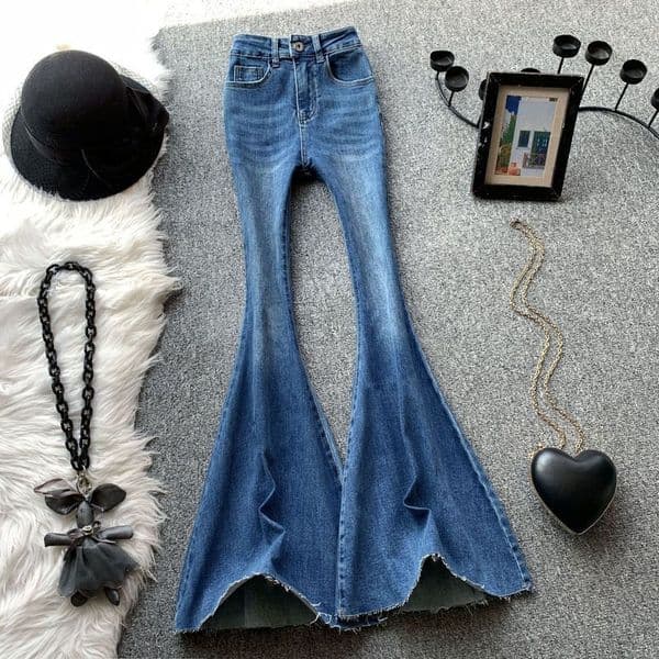 Designer women's blue flared jeans, high waisted sexy girl, slim fit, elastic, raised hips, rough edges, floor hugging, slimming pants