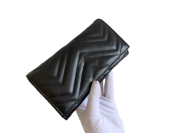 Elegant designer's wallet with multiple compartments and secure card slots