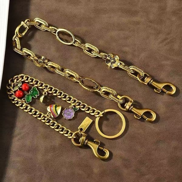 2026 New New Fashion Dinosaur Charm Accessories Designer Bag Or Keychain Pendant Co Ch Cherry Decoration Personalized Womens Wallet Chain Bracelet Dhg