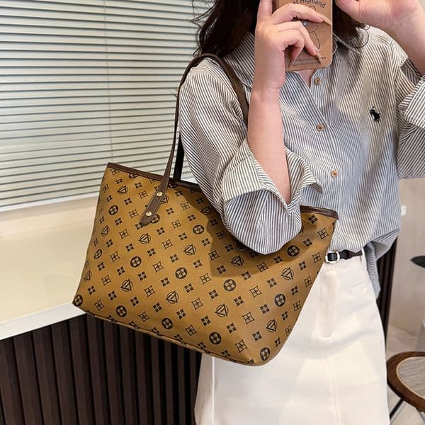 Texture large capacity shoulder bag, niche multifunctional women's commuting bag, new simple handheld handbag, designer bag