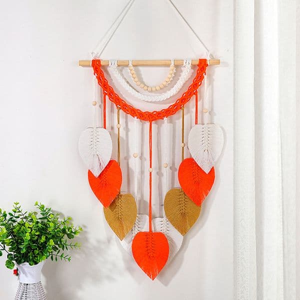 Tribal style macrame wall decor with triangular patterns and earthy palette designed for culture inspired home design