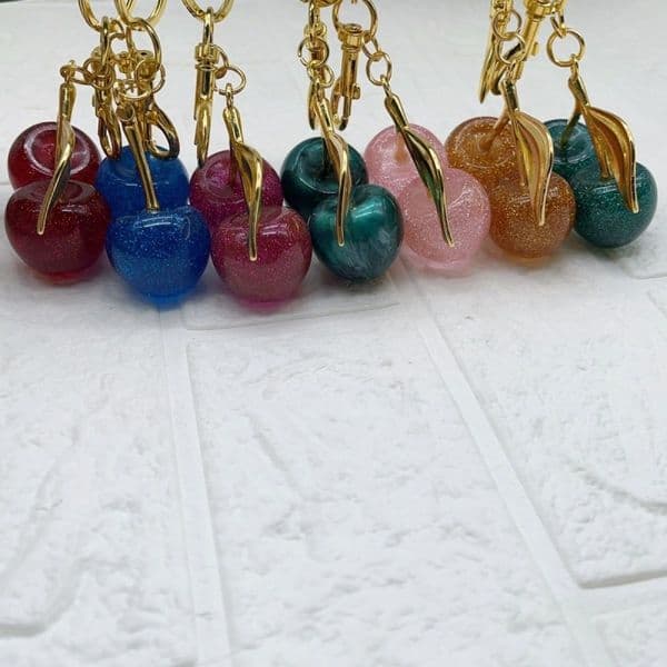 Luxury-sleek fashion fruit-themed keychain, bag hanger, pendant for women's school uniforms. Gift for girlfriend's graduation with juicy cherries.