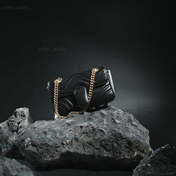 The handbag with a single shoulder strap and a slanted design, meticulously crafted by 99A designers, embodies a sophisticated style through its leather material.