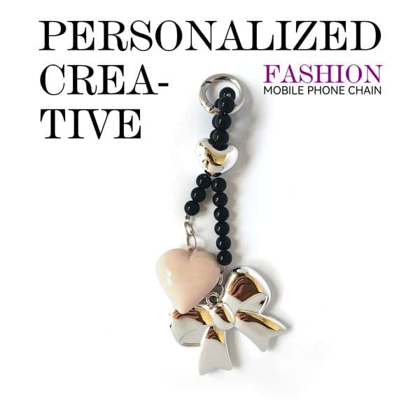 Pink heart-shaped charm with metallic-finish large bow, black pearl bracelet phone strap. Creative design pairing, anti-loss feature, convenient to carry.