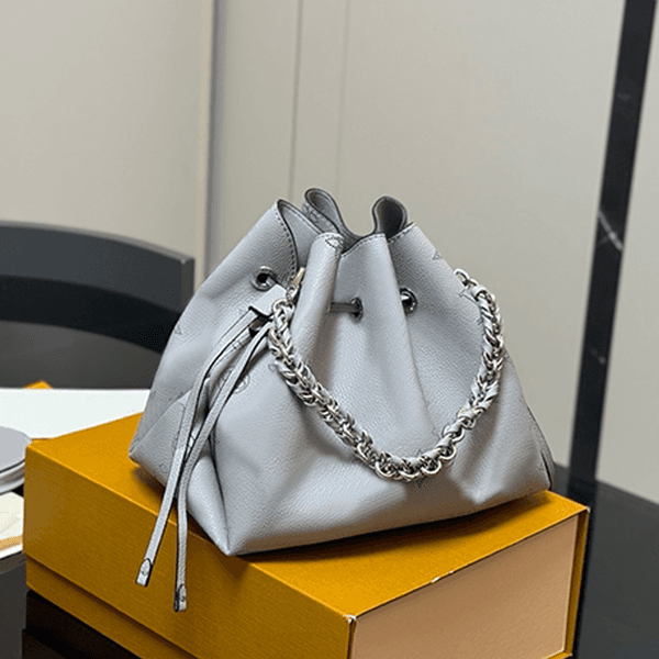 Fashionable hollowed-out drawstring bucket bag, classic monogram bag, luxury designer bag, women's single-shoulder bag, high-end handbag, practical crossbody bag