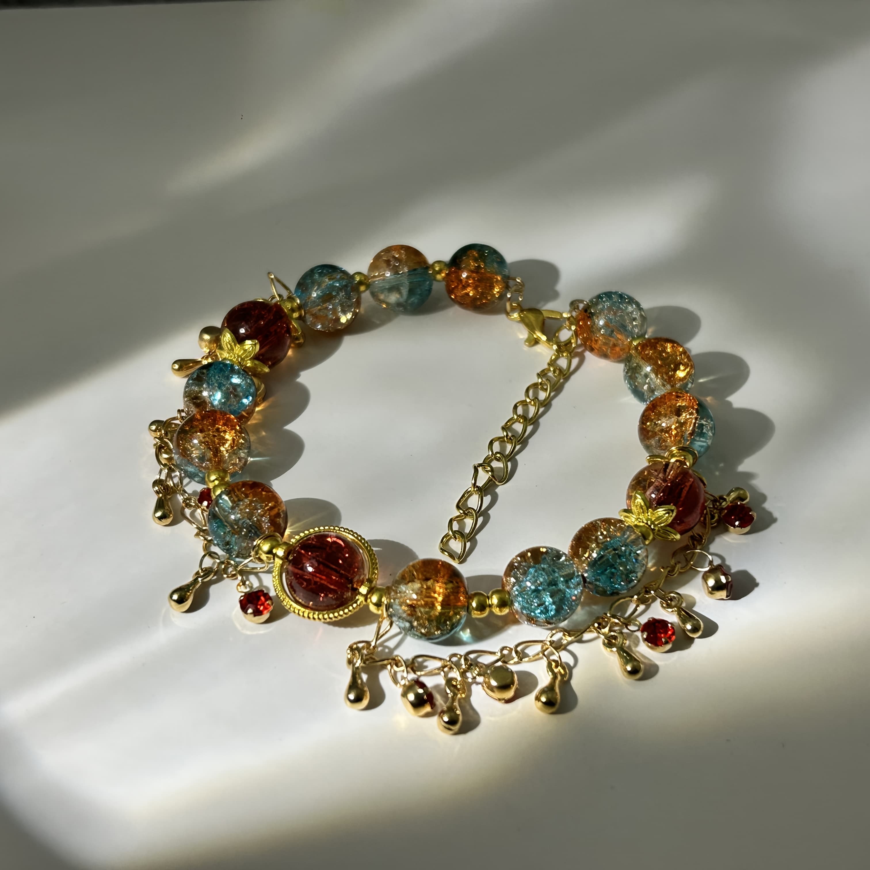 TEMU The " Dream Hu" Bracelet Features A Blend Of Desert And Crescent , With Vibrant Orange And Blue Resin Beads. It Has An Adjustable Chain And Is -colored Deer From