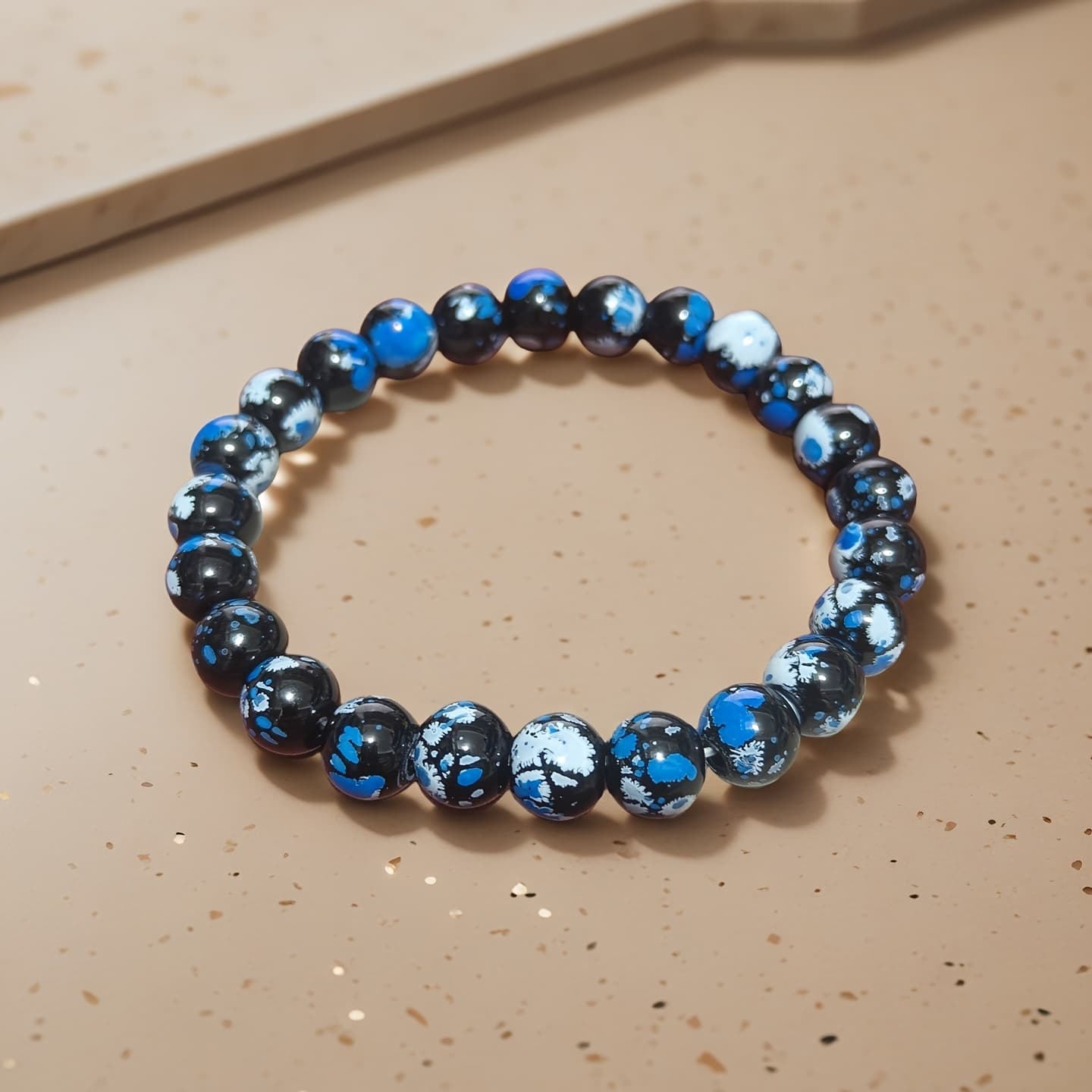 TEMU A Stretch Bracelet Made Of 8mm Round Beads In Black, White, And Blue, Featuring A Colorful Printed Design In A European And , Perfect For Men And Women And Ideal For Gifting